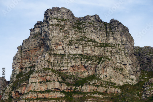 Panorama view of Lions Head mountain in Cape Town, South Africa during summer holiday and vacation. Scenic landscape of rock and texture hill in a remote hiking area against blue sky.
