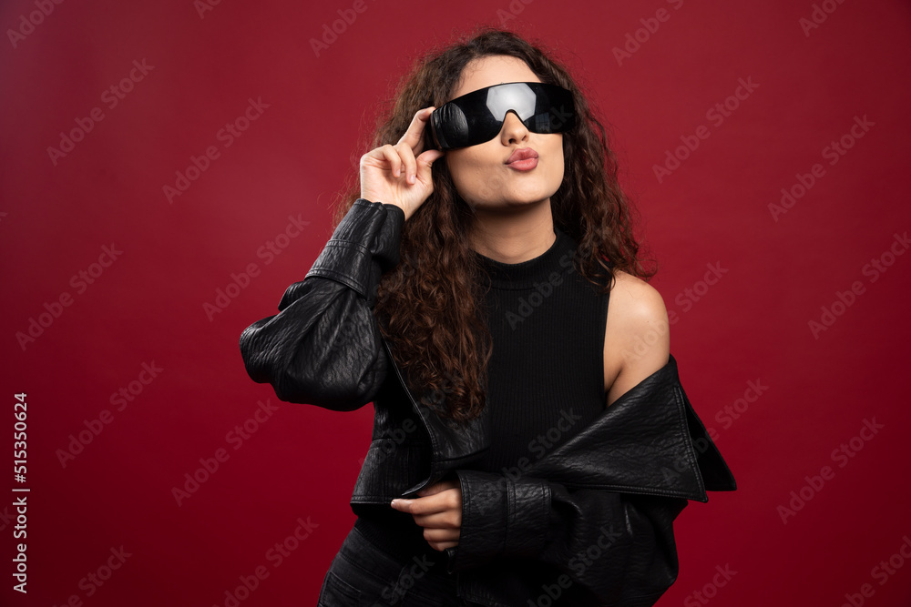 Woman in all black outfit wearing black glasses Woman in all black outfit wearing black glasses
