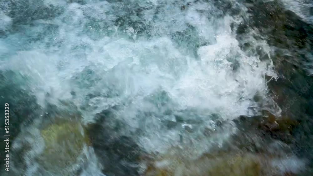 Slow motion shot of water fall splashes in hilly area of Pakistan