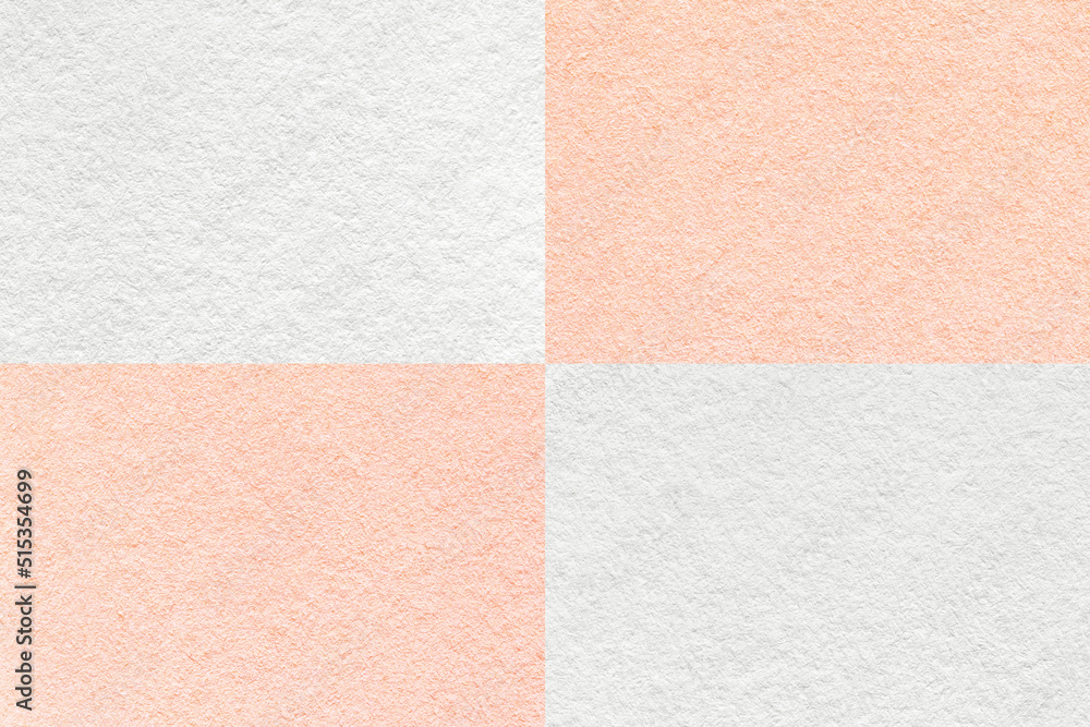 Fototapeta premium Texture of craft white and pearl coral paper background with cells pattern, macro. Structure of vintage pink cardboard.