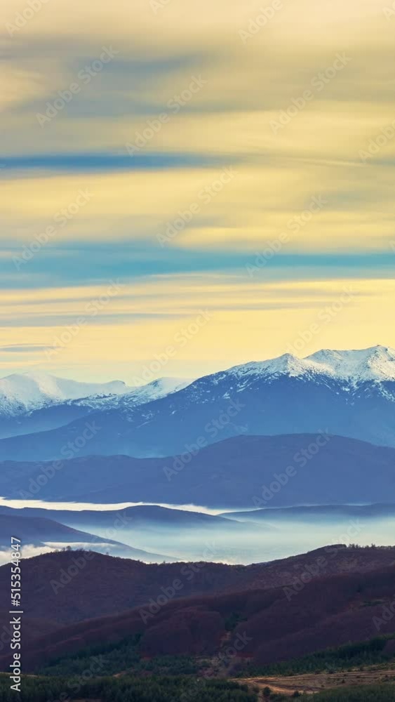 Winter sunset in the mountains, clouds and fog, time lapse vertical video Winter sunset in the mountains, clouds and fog, time lapse vertical video