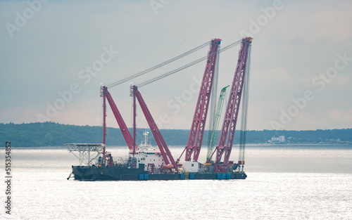 Massive heavy lift Crane on a large barge. Used in everything from salvage operations to construction at sea.