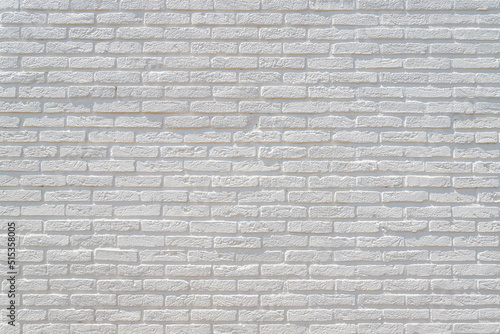 White grey brick background  Abstract geometric pattern  Brick block texture with sunlight  Modern style outdoor building wall  Can be used as background for display or montage your products.