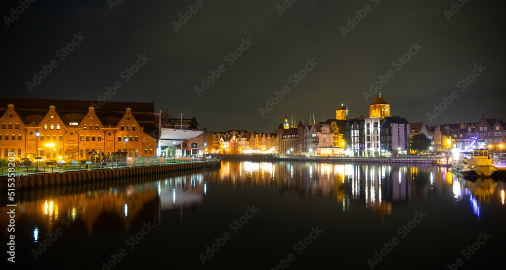 Fototapeta premium Picturesque summer evening panorama of the architectural pier of the Old Town GDANSK, POLAND