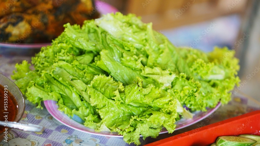 fresh salad in a green bowl for extra food fresh salad in a green bowl for extra food