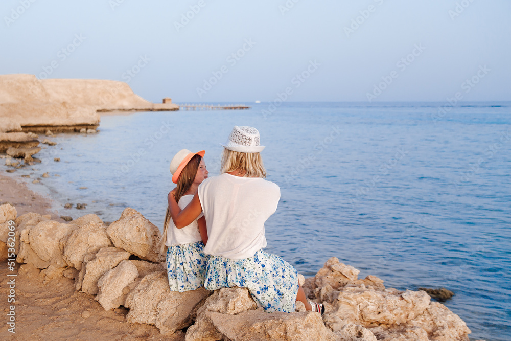 person sitting on the beach