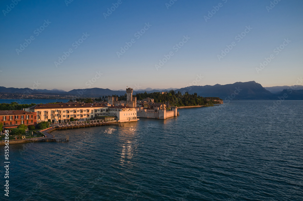 Sirmione on Lake Garda, Italy. Aerial view of Scaligero Castle at sunrise.