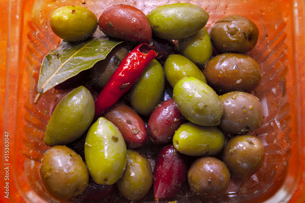 Pickled olives with hot peppers . Greek colorful olives Pickled olives with hot peppers . Greek colorful olives