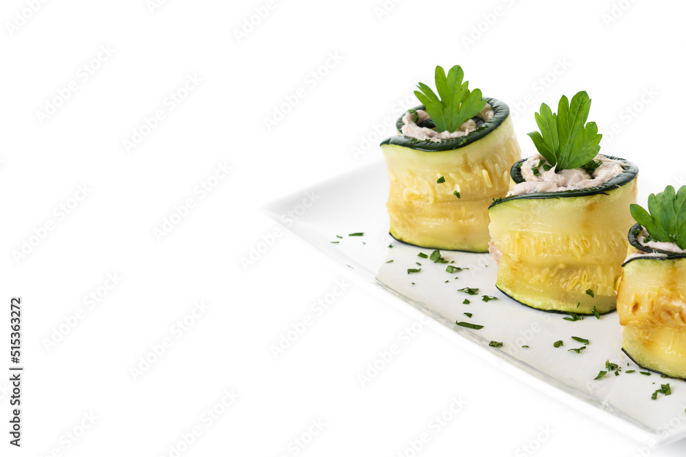 Grilled zucchini rolls with tuna and cream cheese isolated on white background. Copy space Grilled zucchini rolls with tuna and cream cheese isolated on white background. Copy space