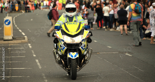 British police motorcycle rider on patrol, 