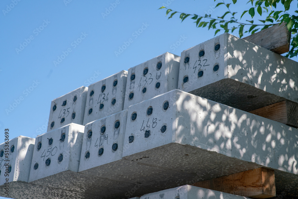 Stack of black and white concrete railway sleepers, for railway
