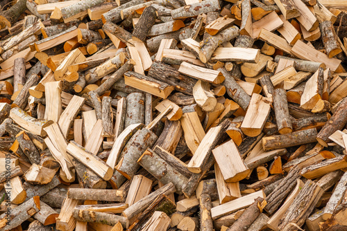 Slika na platnu A pile of stacked firewood, prepared for heating the house