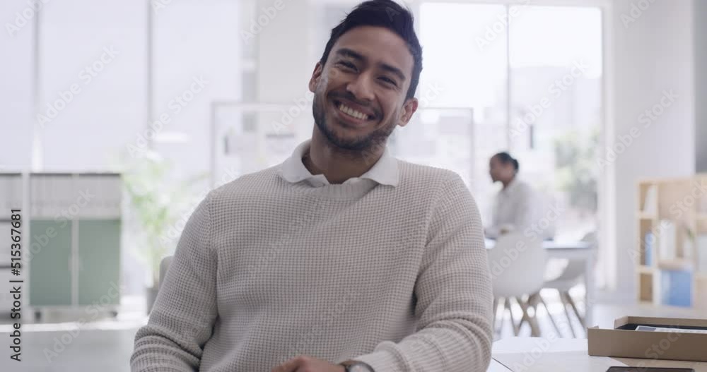 Young businessman using a computer in a trendy modern office. Portrait of an entrepreneur happy with his business project proposal. A marketing tech professional working on company website analytics Young businessman using a computer in a trendy modern office. Portrait of an entrepreneur happy with his business project proposal. A marketing tech professional working on company website analytics
