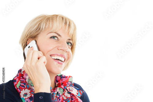 Young charming woman calling with cell telephone. Attractive female with cute smile having talking conversation with mobile phone. Isolated on white background. Studio shot