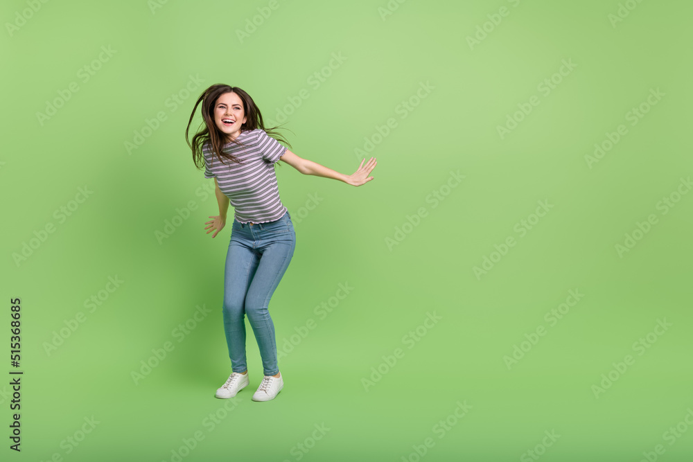 Full length body size view of attractive cheerful girl dancing clubbing copy space isolated over bright green color background Full length body size view of attractive cheerful girl dancing clubbing copy space isolated over bright green color background