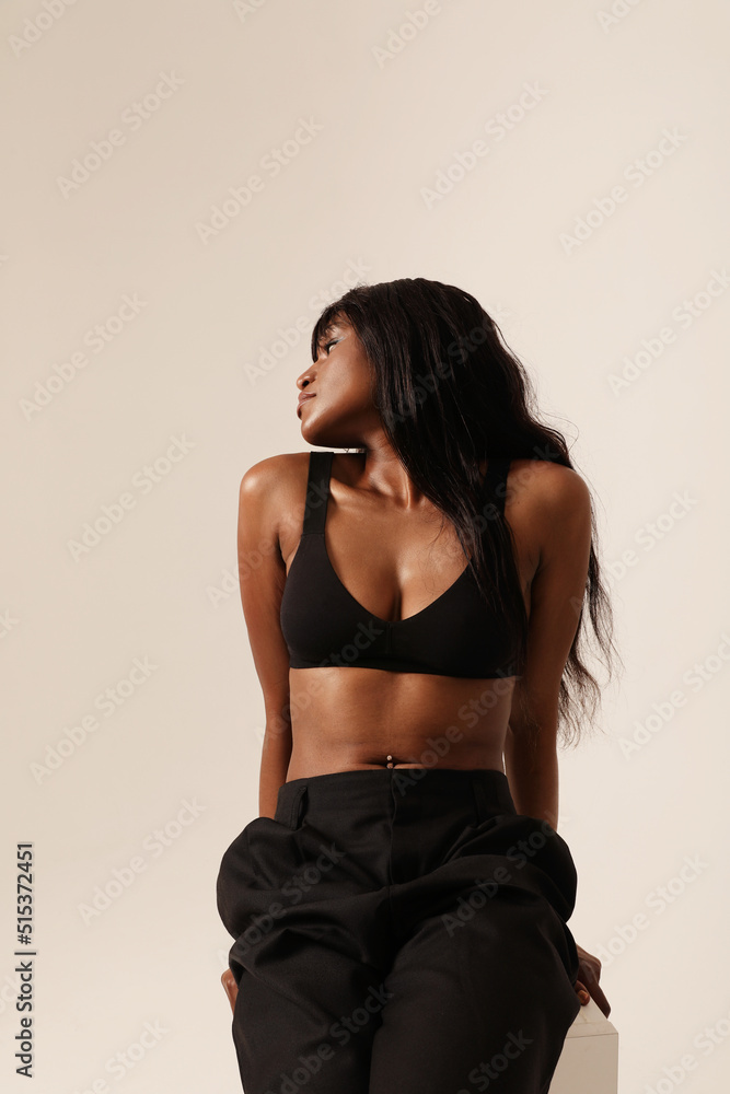 Vertical portrait of beautiful African American woman posing indoor. Vertical. Vertical portrait of beautiful African American woman posing indoor. Vertical.
