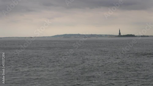 Statue of Liberty seen from Battery Park.
Long shot across the Hudson of the Statue of Liberty on Ellis Island, New York.