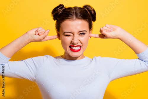 Photo of angry lady suffer noisy music hide ears fingers isolated vivid color background