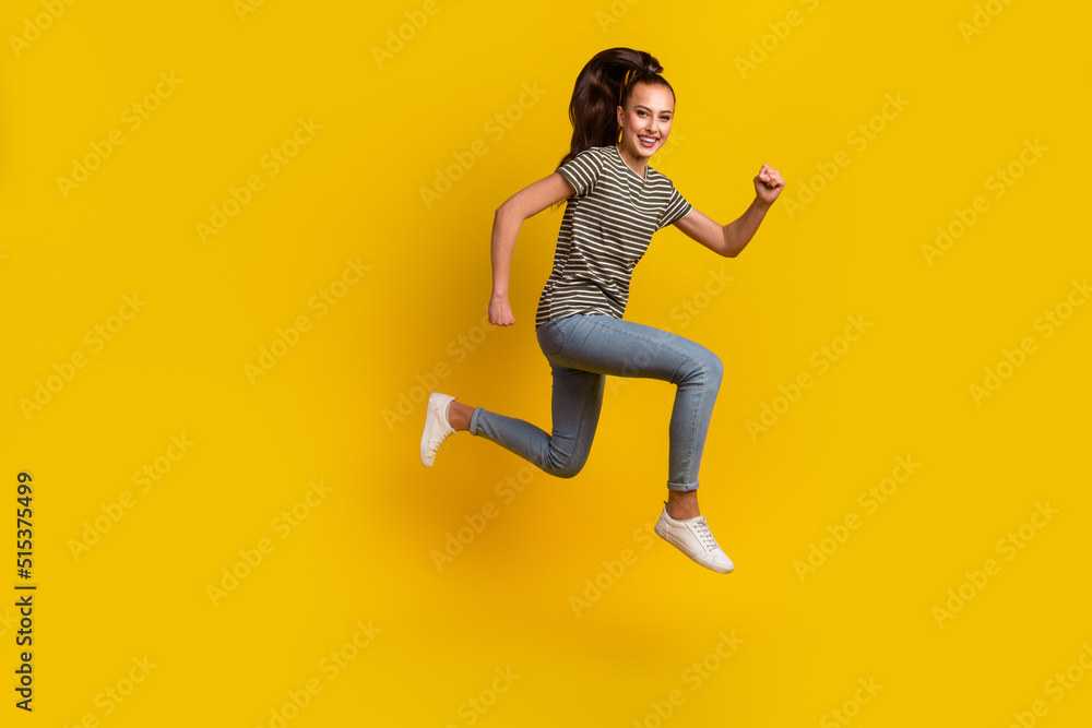 Full length body size photo of jumping high female student overjoyed run isolated on bright shine color background