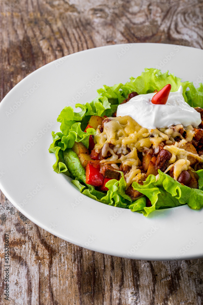 Salad with cheese, sour cream, meat, potatoes, olives Salad with cheese, sour cream, meat, potatoes, olives
