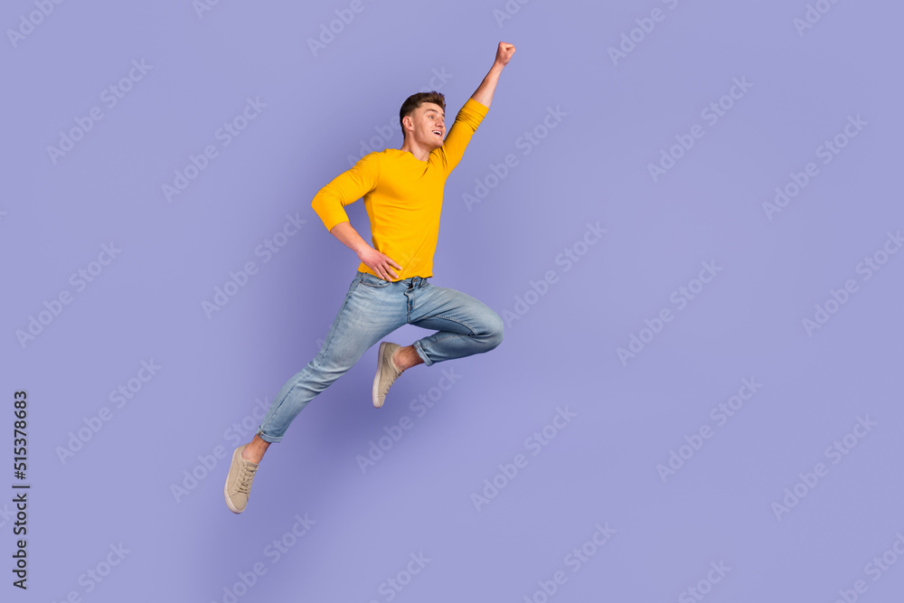 Full size profile side photo of young man jump up fly help protection strong isolated over violet color background