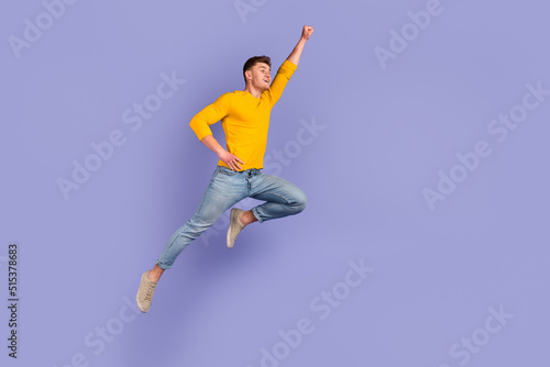 Tableau sur toile Full size profile side photo of young man jump up fly help protection strong iso