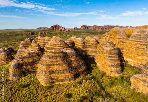 Banded beehive shaped sandstone formations at the Bungle Bungle National Park, Purnululu, in the Kimberley Region of Western Australia photo