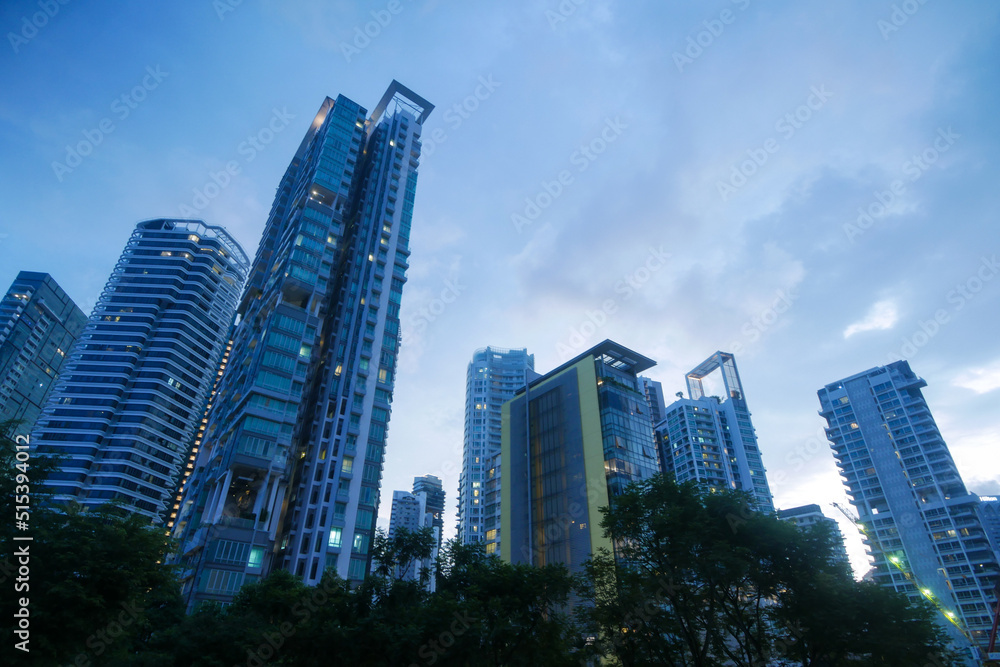  low angle view of singapore modern city buildings.