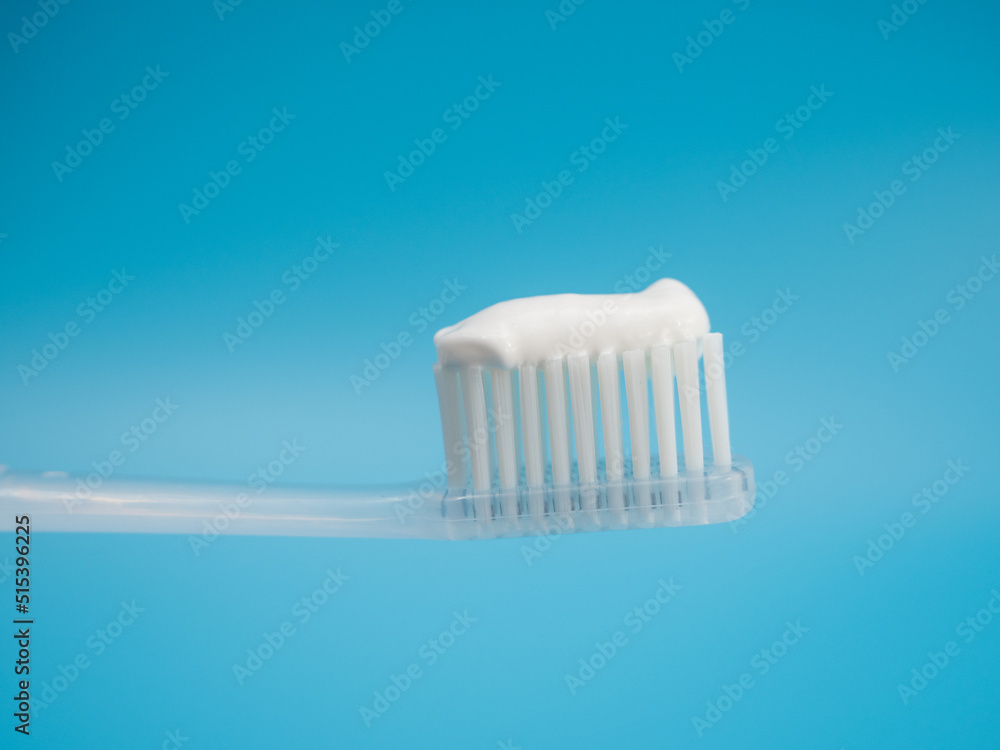 Toothbrush with copy space on blue background. Toothbrush with copy space on blue background.