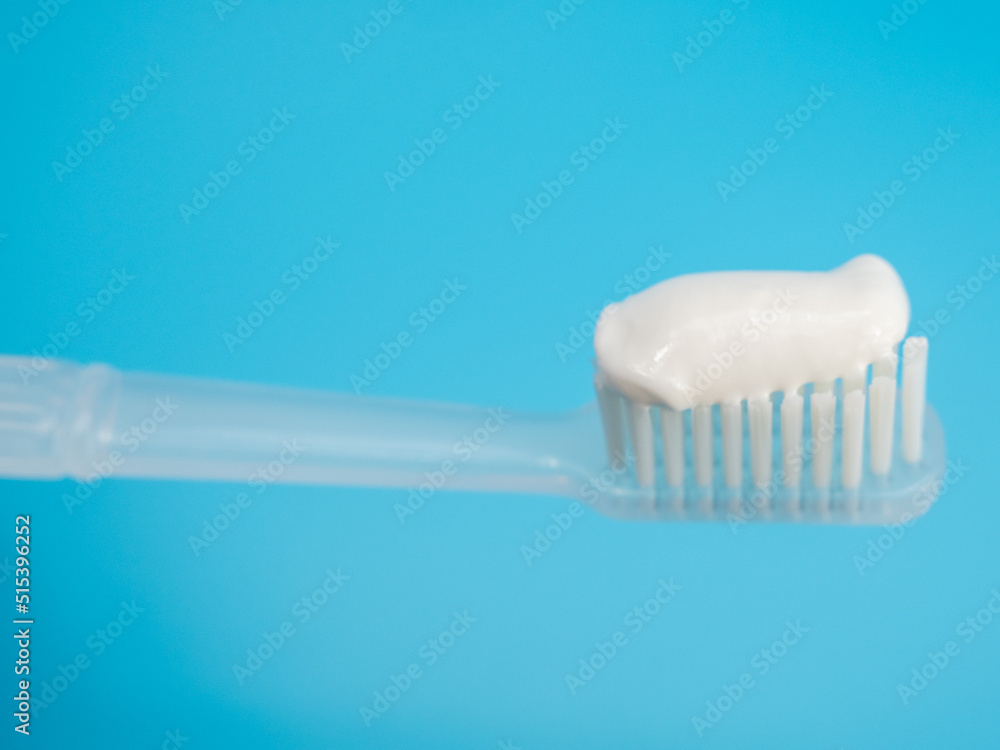 Toothbrush with copy space on blue background. Toothbrush with copy space on blue background.