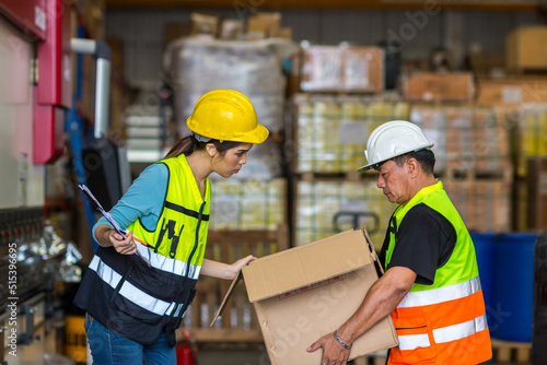 African American worker working in warehouse. Industrial and industrial workers concept. worker woman order details and checking goods and Supplies.