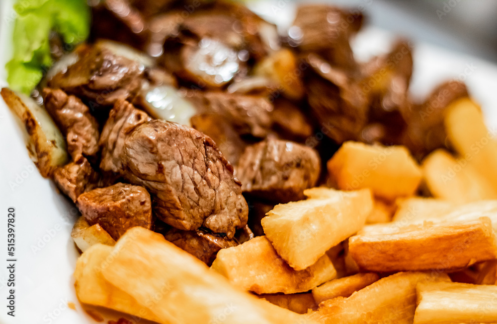 Portion of noble meat with a ipim side of fried in a Brazilian Pub Bar Portion of noble meat with a ipim side of fried in a Brazilian Pub Bar
