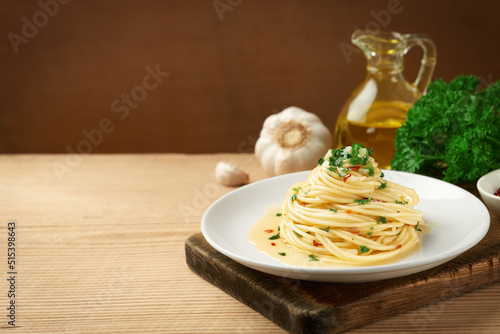 A plate of spaghetti AGLIO E OLIO with copy space photo