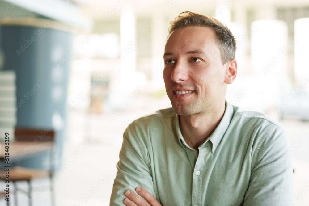 Confident young businessman sitting at cafe portrait Confident young businessman sitting at cafe portrait