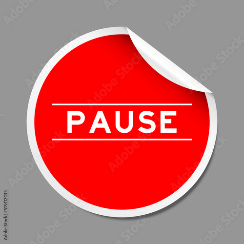 Red color peel sticker label with word pause on gray background