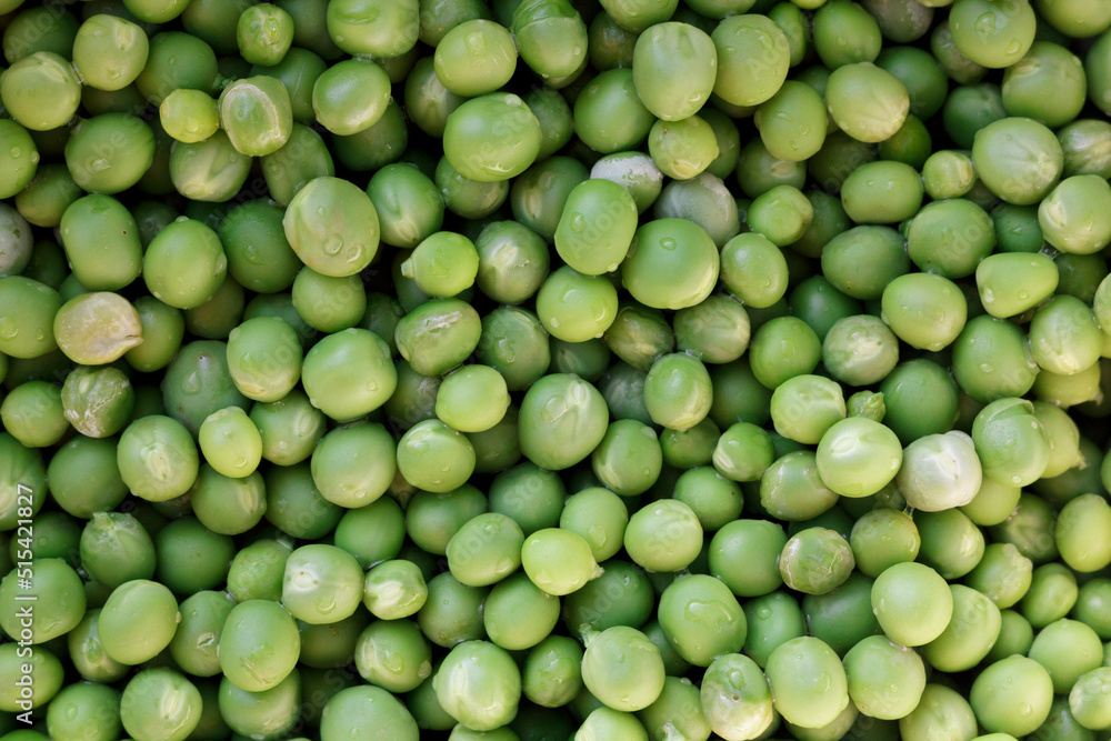 Green peas. Green background. Pea background. View from above. Green peas. Green background. Pea background. View from above.