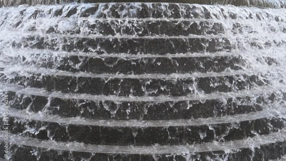 Slow Motion. A view of water streaming down the cascade fountain. Slow Motion. A view of water streaming down the cascade fountain.