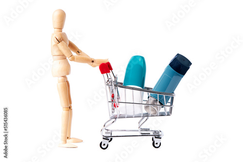 Dummy pushing shopping cart with inhalers. Medicine concept © luismicss