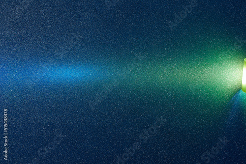 On a dark blue rough gradient background in fine grain, a yellow and blue transitional gradient beam of light