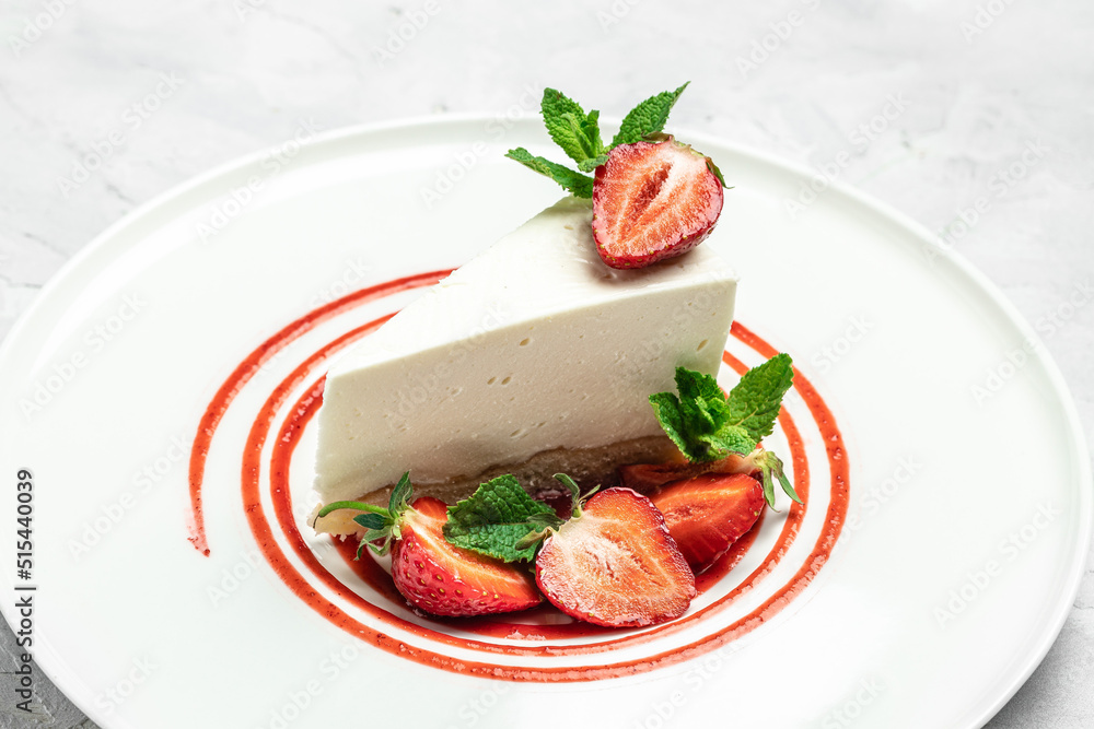 Strawberry Cheesecake with Strawberry Syrup. piece of cheesecake decorated with strawberry sauce on white background