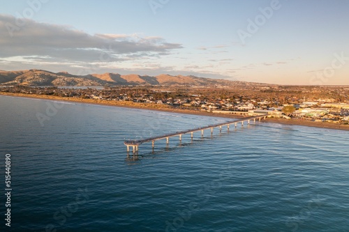 Aerial drone shot during sunrise at New Brighton beach, Christchurch, South Island, New Zealand photo