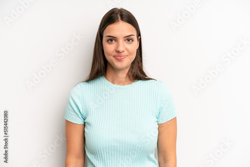 young adult pretty woman smiling positively and confidently, looking satisfied, friendly and happy