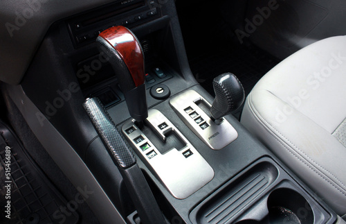 Close up of the automatic gearbox lever SUV, black interior car. Off road Automatic transmission gearshift stick, Closeup a manual shift of modern car gear shifter, off road suv automatic gearbox