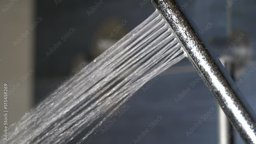 open the water for shower in the bathroom - waste of drinking water in homes in times of drought and aridity problem - incorrect use of natural resources by man open the water for shower in the bathroom - waste of drinking water in homes in times of drought and aridity problem - incorrect use of natural resources by man