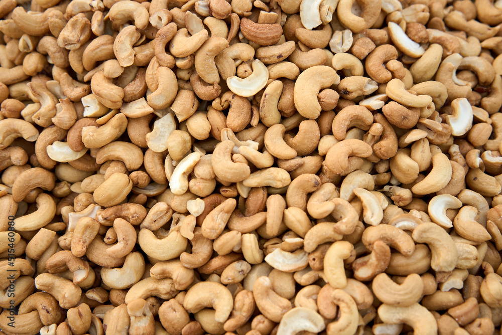Tasty cashew nuts as background, top view. High quality photo Tasty cashew nuts as background, top view. High quality photo