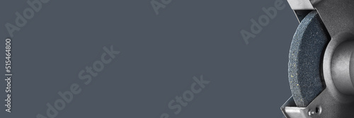 Abrasive emery for sharpening tools close up on gray background. Photo with copy space.