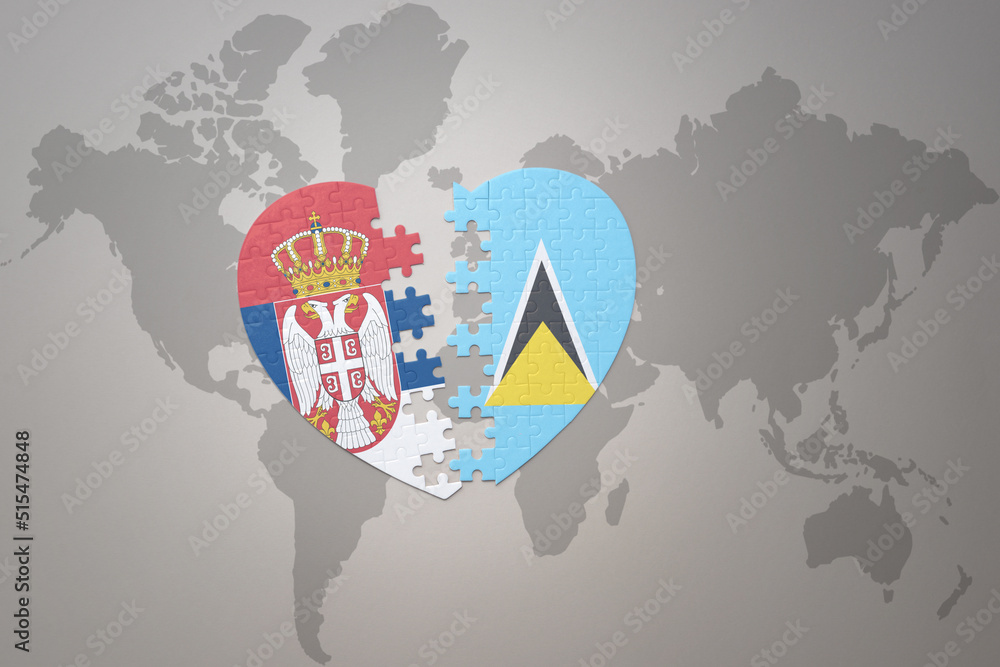 puzzle heart with the national flag of saint lucia and serbia on a ...