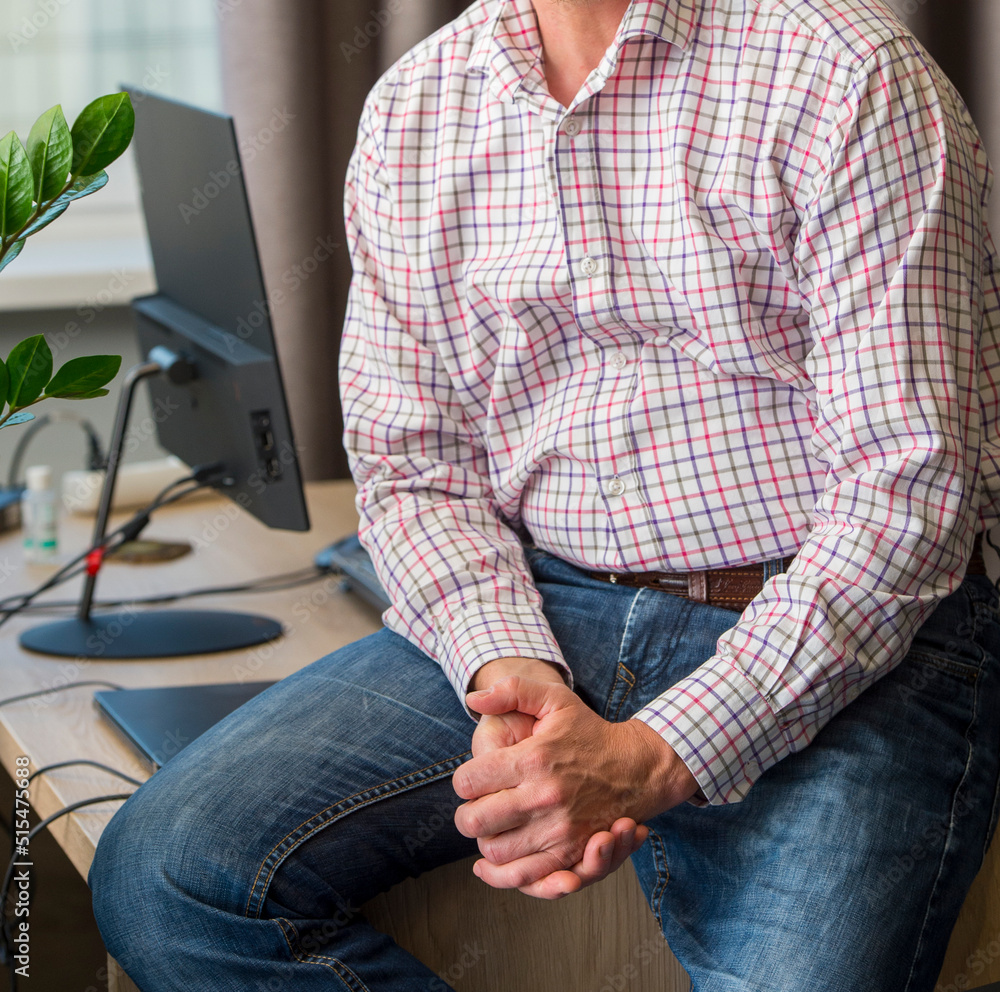 IT specialist at the workplace in casual clothes. hands of a businessman during a meeting close-up IT specialist at the workplace in casual clothes. hands of a businessman during a meeting close-up