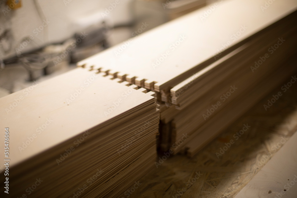 Blanks made of wood. Board in workshop. Details of furniture production. Joinery. Blanks made of wood. Board in workshop. Details of furniture production. Joinery.