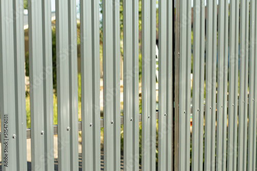 Steel fence. Fence around area. Grey steel profile.